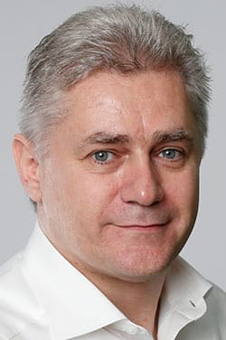 Porträt von Andreas Hajek, IT-Berater vor einem neutralen Hintergrund.